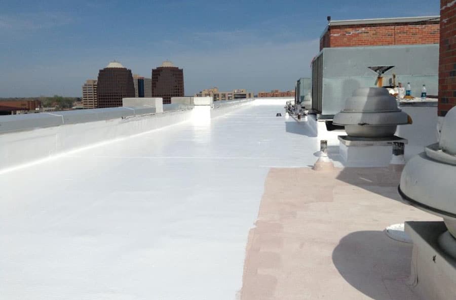 Silicone roof coating on a commercial flat roof
