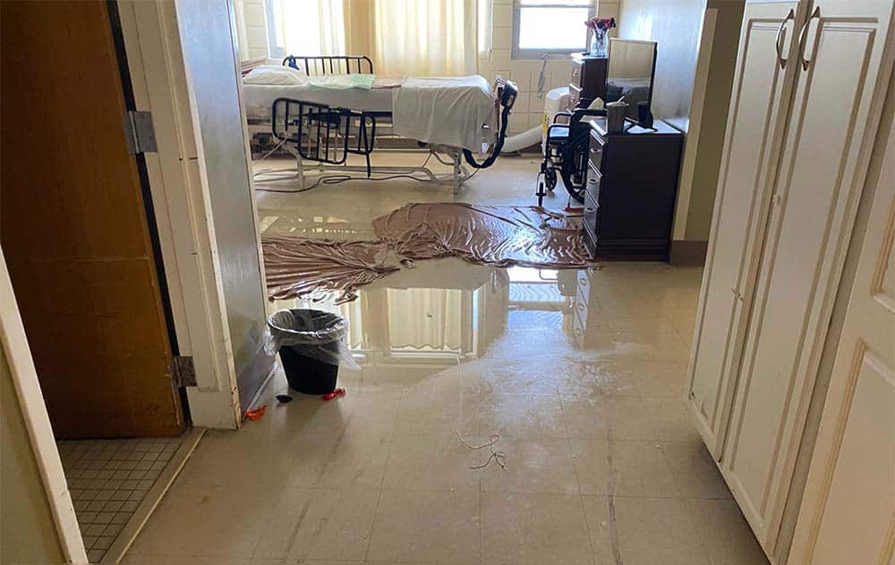 Standing water on a building floor after a storm